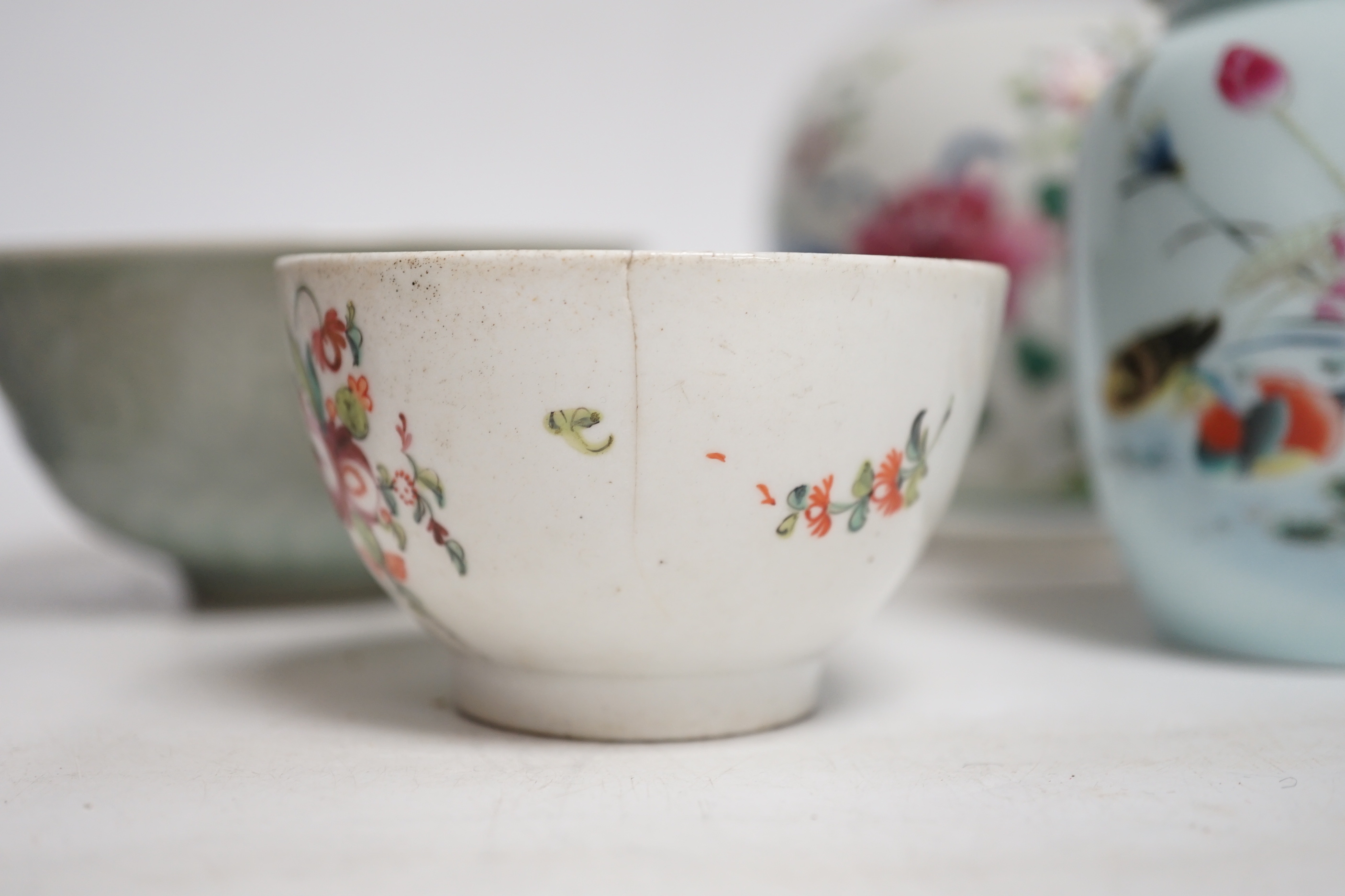 A collection of Chinese ceramics including celadon bowl decorated in low relief with fish, famille rose tea bowls and a jar, largest 12cm high